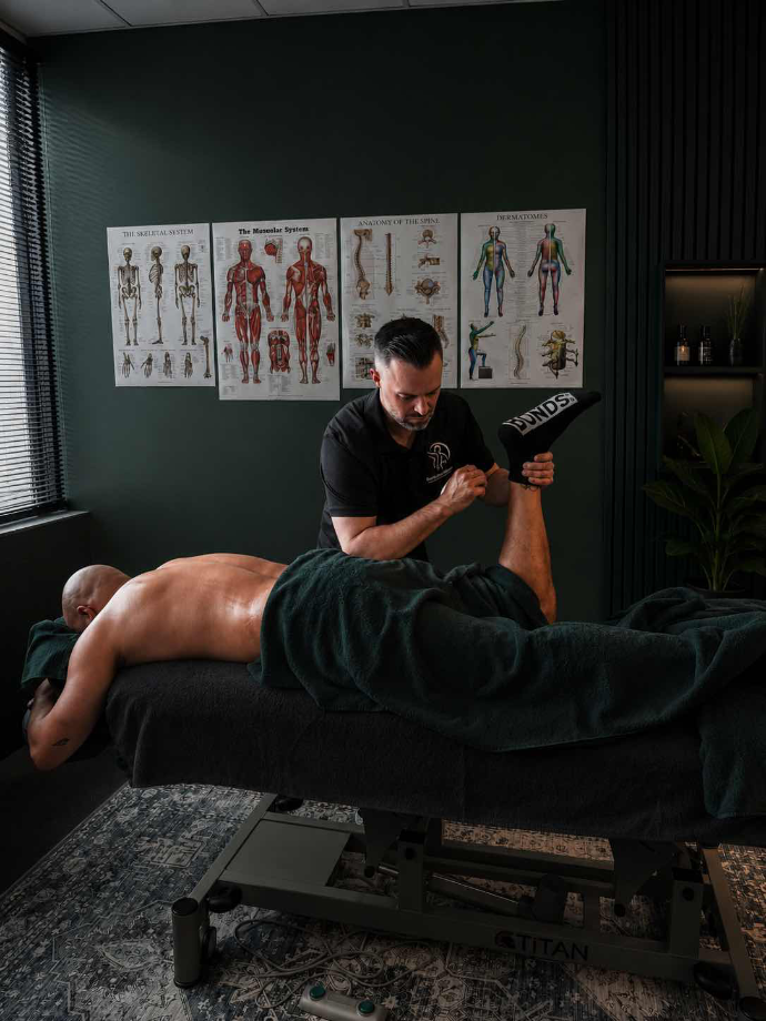 Therapist providing remedial massage